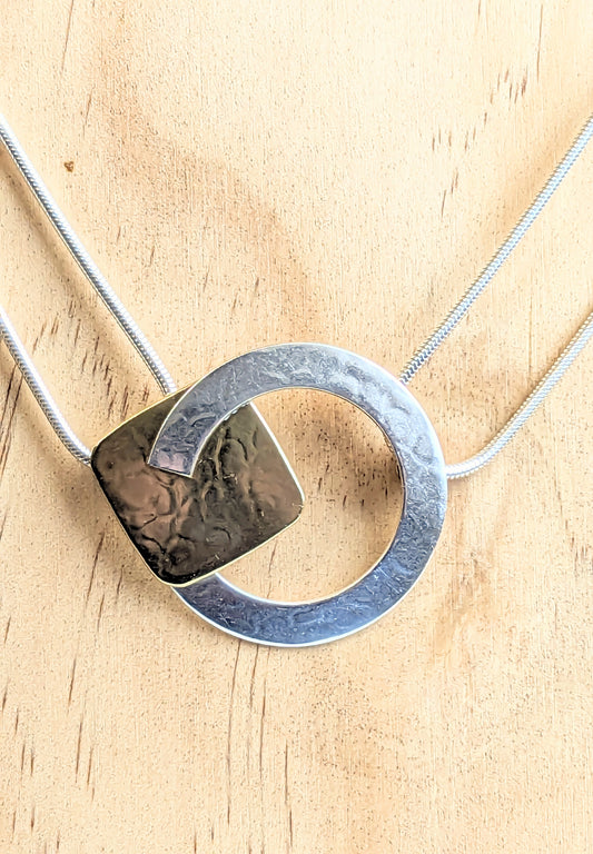 MARJORIE BAER SILVER CIRCLE CUTOUT AND BRASS SQUARE NECKLACE