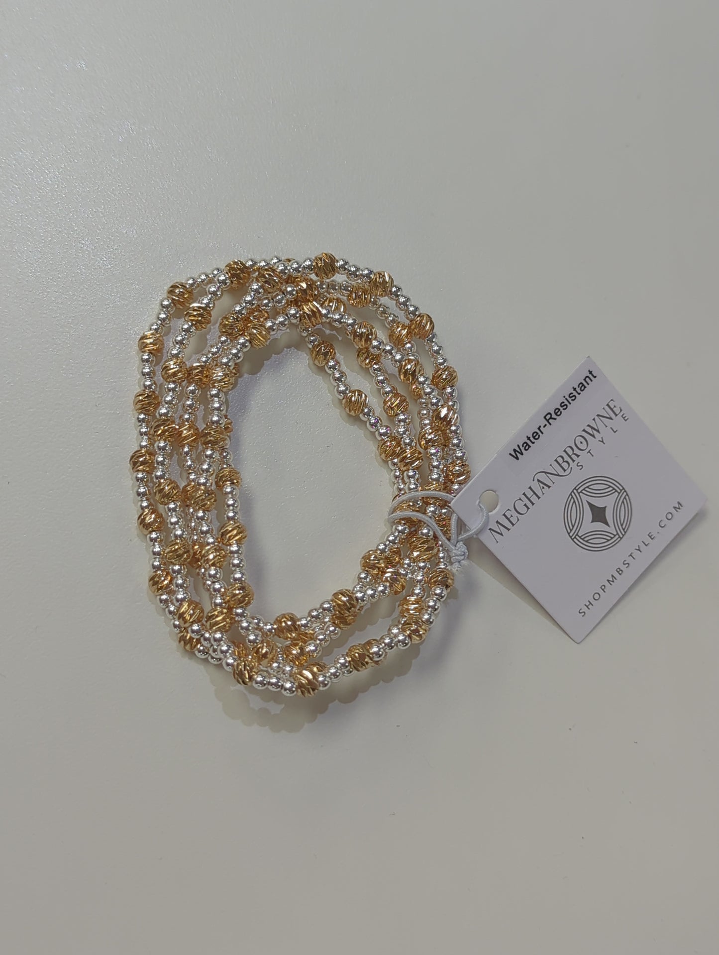 MEGHAN BROWNE HULA GOLD AND SILVER BRACELET